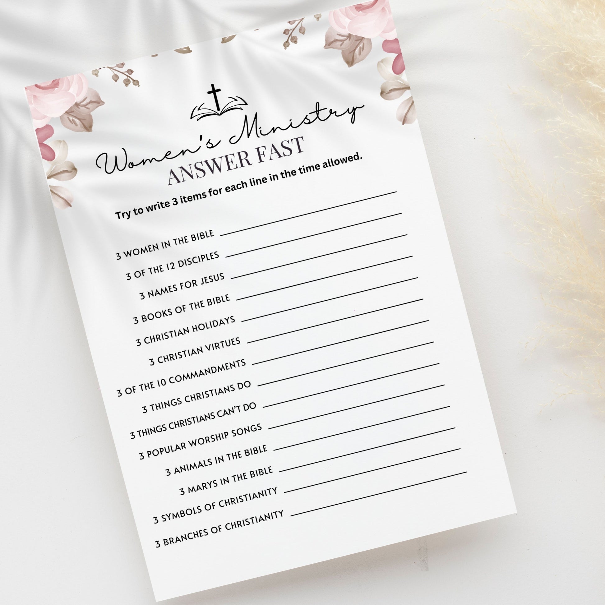 Women's Ministry Answer fast printable game laying on a white table